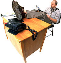 Man with feet on desk